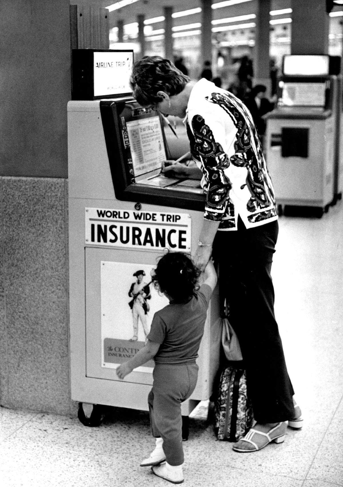 Shot 6/21/1972: Albert Coya/Miami Herald Staff -- Filling out world wide trip insurance forms at Miami International Airport. Published August 18, 1974.
