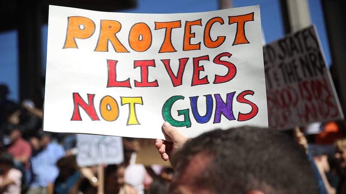 Three days after the Feb. 14, 2018, shooting at Marjory Stoneman Douglas High School, people gathered on the steps of the Broward County Federal Courthouse to protest the proliferation of guns. The massacre helped propel a lawsuit by Florida cities seeking to strike down a $5,000 fine facing mayors if they enact gun-control laws stricter than what’s on the state books.