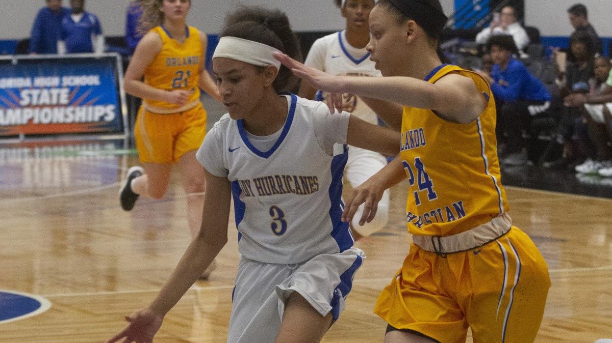 Somerset Prep’s Kourtnee Gilbert (3) drives toward the basket as Orlando Christian’s Siarah Brown (24) tries to defend during the first half of their FHSAA Girls 3-A Semifinal game at The RP Funding Center in Lakeland Monday. February 25, 2019. Somerset won by a score of 56-20. (SPECIAL TO THE HERALD/MICHAEL WILSON)