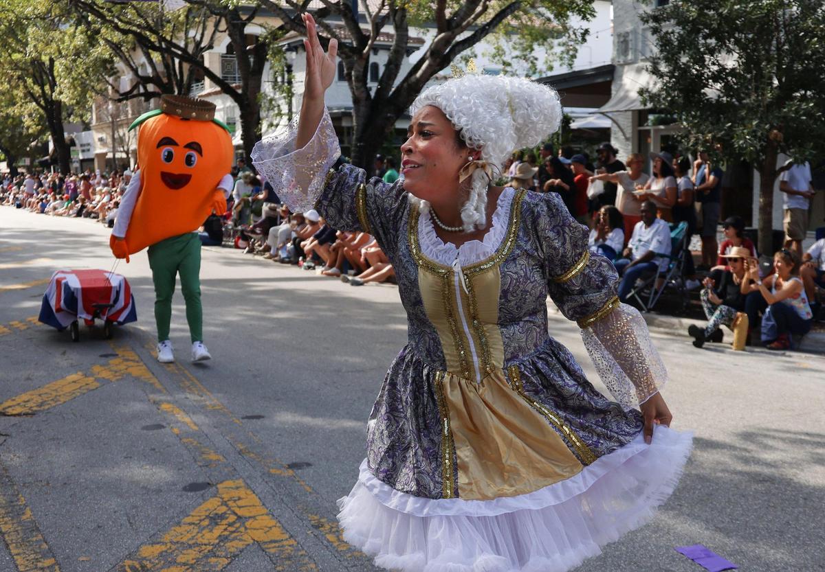 It’s hard to be a queen, especially if you are dead, Venus Lovely waves to the parade crowd as an expression of adoration during the 39th Annual King Mango Strut on Sunday, Jan. 8, 2023.