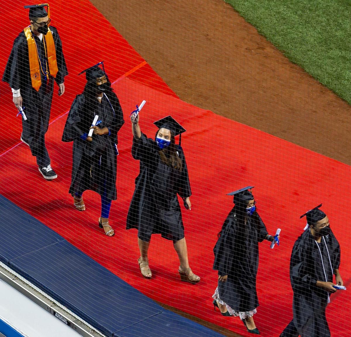 Miami Dade College students attend their graduation ceremony inside loanDepot park in Miami, Florida on Saturday, May 1, 2021.