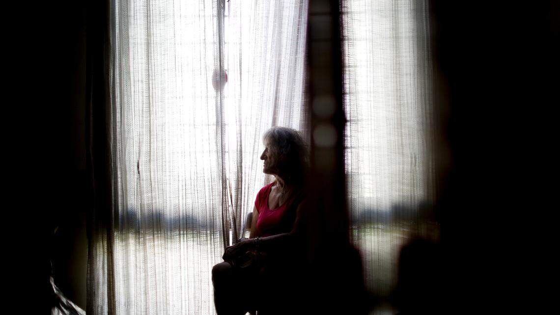 Carmela Corleto poses for a portrait at her home where she lives alone and waits her turn to get a COVID-19 vaccine in Burzaco, Argentina, Thursday, Feb. 18, 2021.