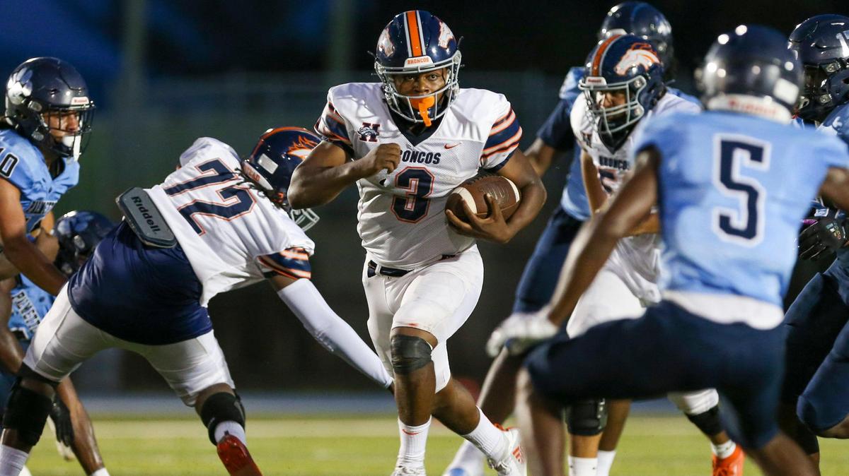 Homestead Broncos quarterback Joshua Townsend (3) runs with the football during the second quarter of a high school football game against the Palmetto Panthers at Tropical Park Stadium in Miami, Florida, Thursday, August 25. 2022.