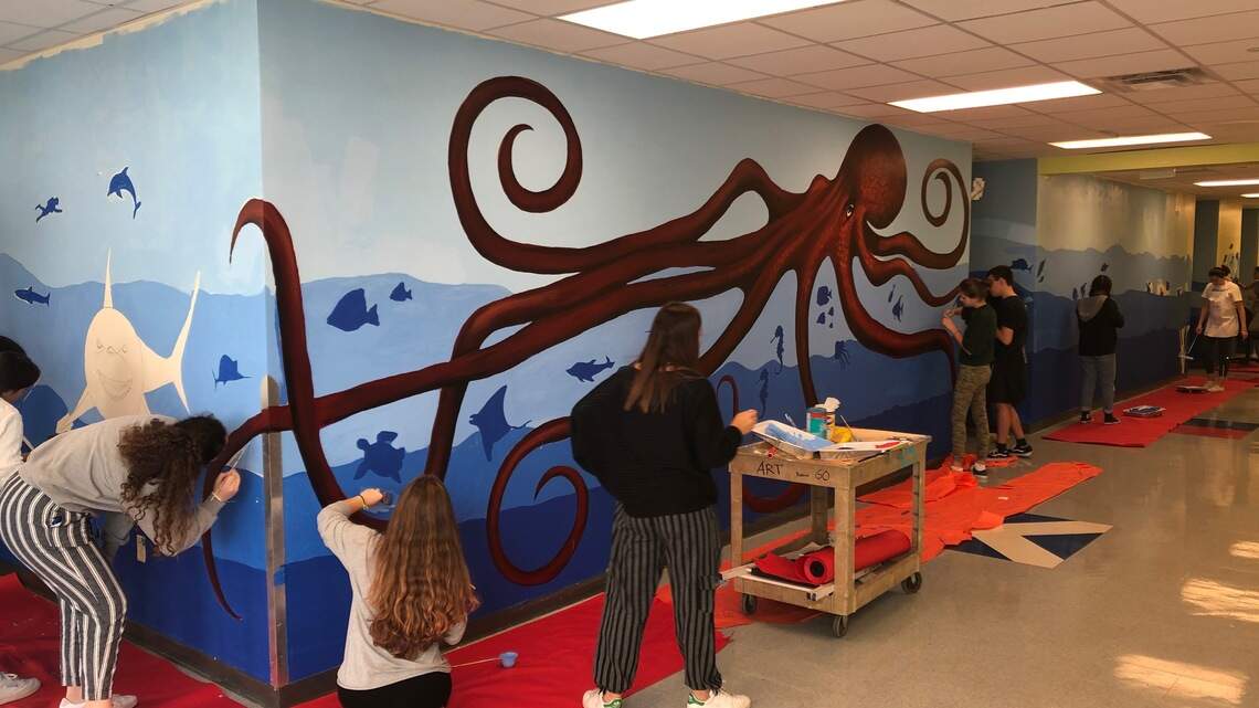 Grove Arts Festival artists mentor students on making art. Mural at MAST in the works