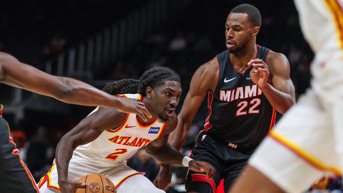 Atlanta Hawks guard Keaton Wallace (2) drives the ball towards the basket against Miami Heat forward Andrew Wiggins (22) during the first quarter at State Farm Arena.