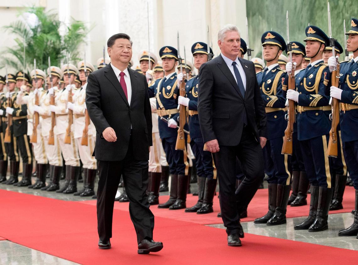 Chinese President Xi Jinping, left, and Cuban President Miguel Díaz-Canel review an honor guard during a welcome ceremony at the Great Hall of the People in Beijing on Nov. 8, 2018.