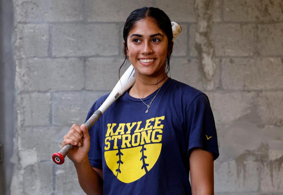 Doral Academy High School girl’s softball player Yessenia Lopez poses for a photograph on Wednesday, May 24, 2023.