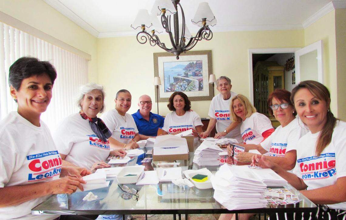 North Bay Village Mayor Connie Leon-Kreps (center) during 2014 campaign. She is joined at her kitchen table by state Rep. David Richardson (fourth from left) and North Bay Village mover and shaker Ana Watson (third left), who has since been charged with felony fraud.
