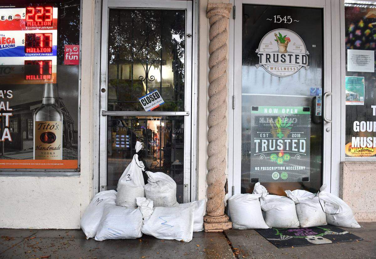 Businesses on Main St. in downtown Sarasota placed sandbags in front of their doors Thursday morning, Sept. 26, 2024, to try and keep water out as Hurricane Helene approaches in the Gulf of Mexico.