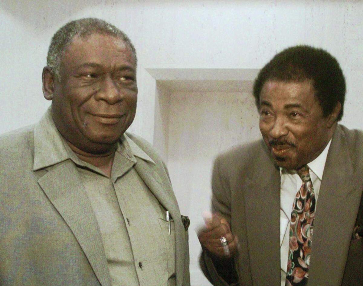 Wilbert Lee, right, reflects his relief as he leaves the capitol with Freddie Pitts, left, after approval of their claims bill of $500,000 each by the Florida Legislature on April 30, 1998, in Tallahassee. The pair were released after spending 12 years in prison for a crime they  didn’t commit.