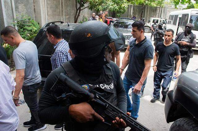 Colombian men accused of involvement in the assassination of former Haitian President Jovenel Moise arrive for a hearing at the Court of Appeals in Port-au-Prince, Haiti, on June 9, 2025. Haitian president Jovenel Moise was assassinated on July 7, 2021 in his Port-au-Prince residence. (Photo by Clarens SIFFROY / AFP) (Photo by CLARENS SIFFROY/AFP via Getty Images)