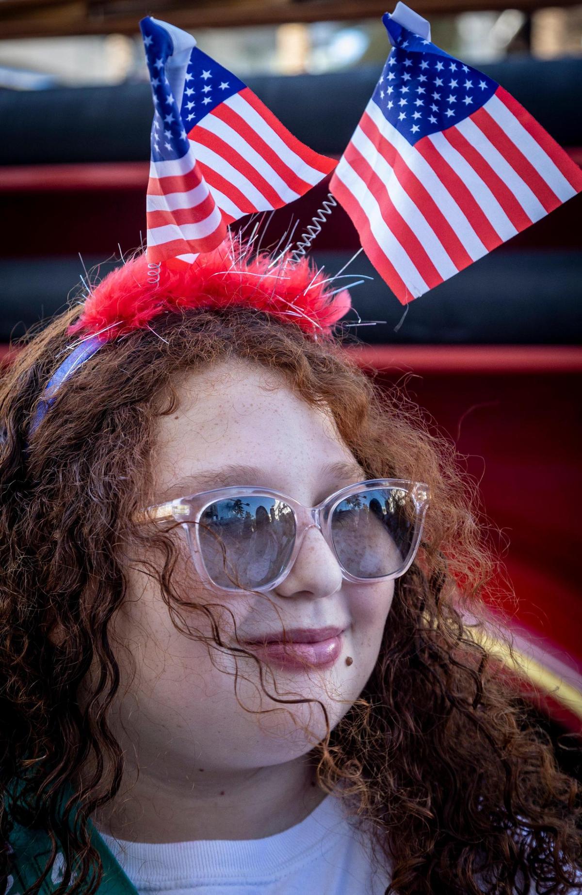 Ten-year-old Kasandra, with Girl Scout Troop 1924, shows off her patriotic headband Friday before the start of the 14th Annual Veterans Day Parade and Celebration, hosted by the city of Miami Beach. The parade took place on Ocean Drive, from Fifth to 15th streets.
