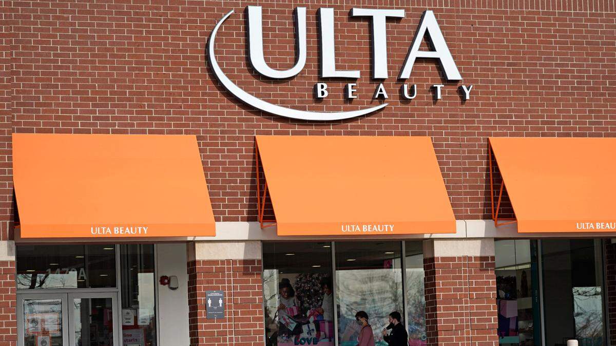 In this Nov. 5, 2020 file photo, women walk to an Ulta Beauty store in Schaumburg, Ill. The company apologized for a promotional email for Kate Spade perfumes that some on social media have called “insenstive.”