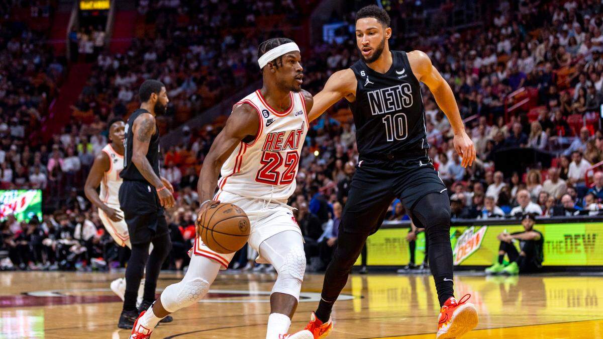Miami Heat forward Jimmy Butler (22) drives on Brooklyn Nets forward Ben Simmons (10) during the first half of an NBA game at FTX Arena in Downtown Miami, Florida, on Sunday, January 8, 2023.