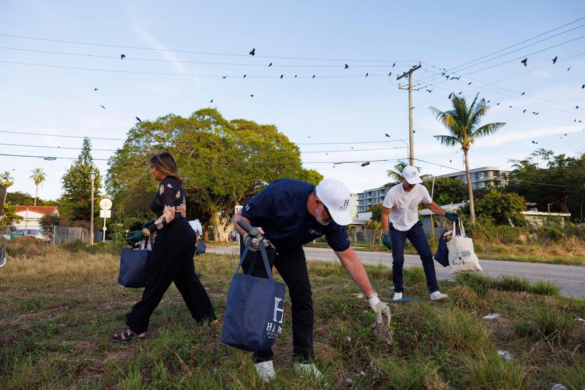 People participate in a street clean up before a Psychedelics for Climate Action (PSYCA) launch event on Wednesday, Feb. 19, 2025, in Little Haiti, Miami. Many people talked about how psychedelics can have natural medical qualities. Others mentioned the importance of protecting the environment because psychedelics connect you to the environment around you.