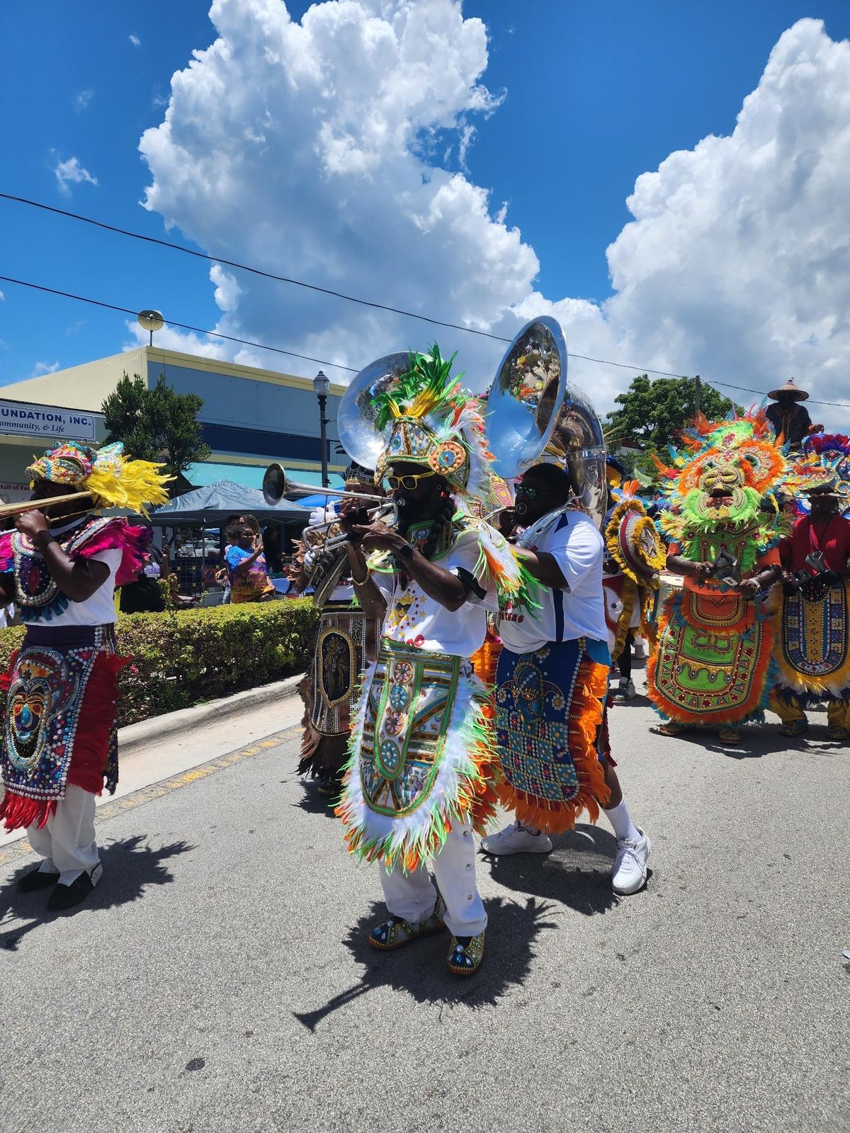 A Junkanoo band marches down the street during the Goombay Festival.