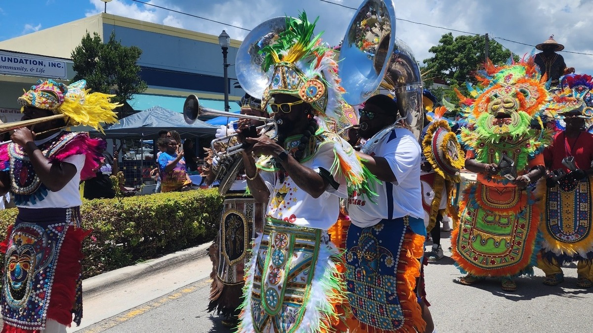 A Junkanoo band marches down the street during the Goombay Festival.