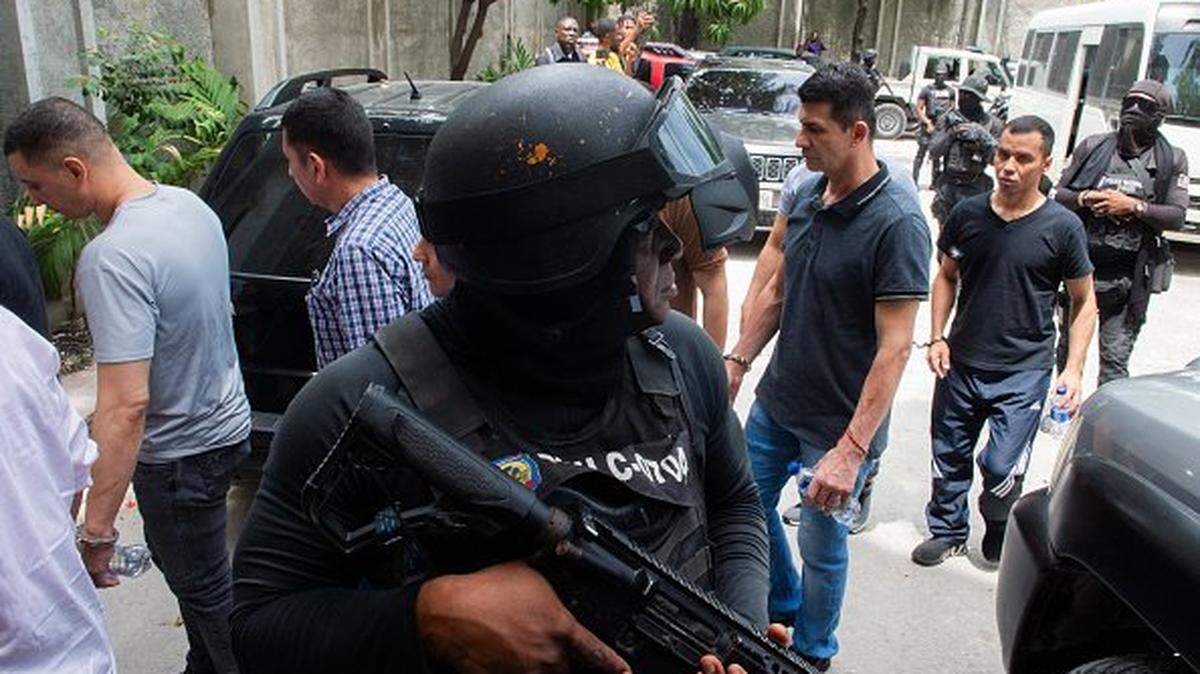 Colombian men accused of involvement in the assassination of former Haitian President Jovenel Moise arrive for a hearing at the Court of Appeals in Port-au-Prince, Haiti, on June 9, 2025. Haitian president Jovenel Moise was assassinated on July 7, 2021 in his Port-au-Prince residence. (Photo by Clarens SIFFROY / AFP) (Photo by CLARENS SIFFROY/AFP via Getty Images)
