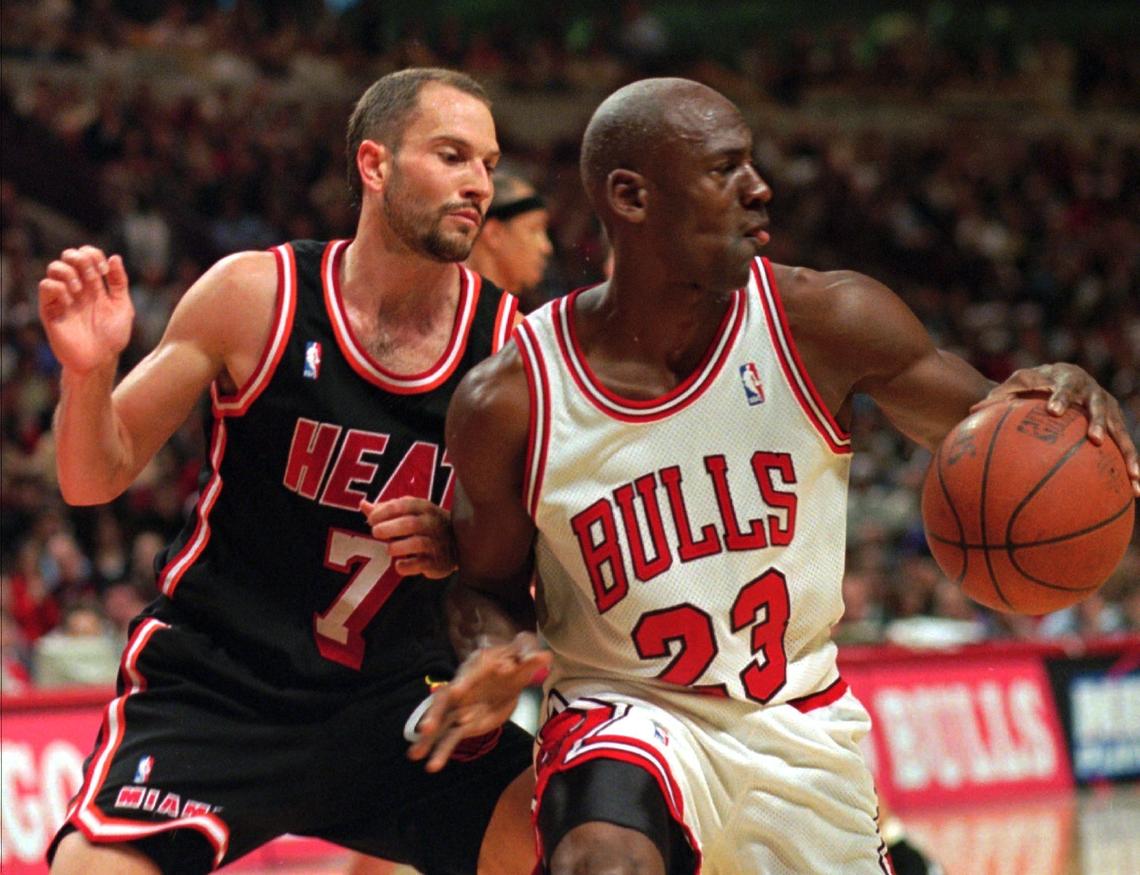 FILE PHOTO - Chicago Bulls’ Michael Jordan, right, controls the ball in front of Miami Heat’s Rex Chapman during the first quarter of their first-round NBA playoff game Friday, April 26, 1996, in Chicago. This was not the game where the undermanned Heat squad beat the Bulls.