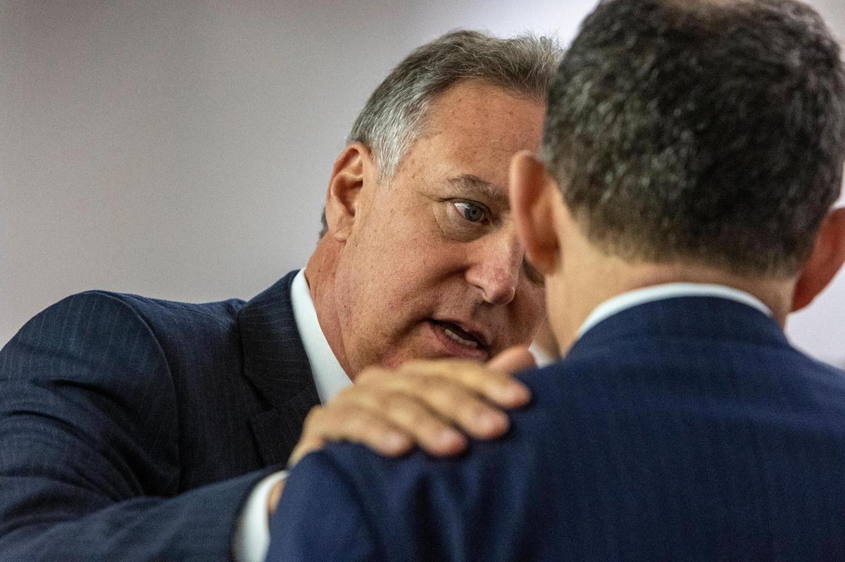 Miami, May 11, 2022 - Court appointed Receiver, Michael Goldberg left, talks to an attorney during court proceedings. In a surprise development, the class-action litigation over the collapse of Champlain Towers South has been settled, a federal judge was told Wednesday, with plaintiffs expected to receive just under $1 billion.