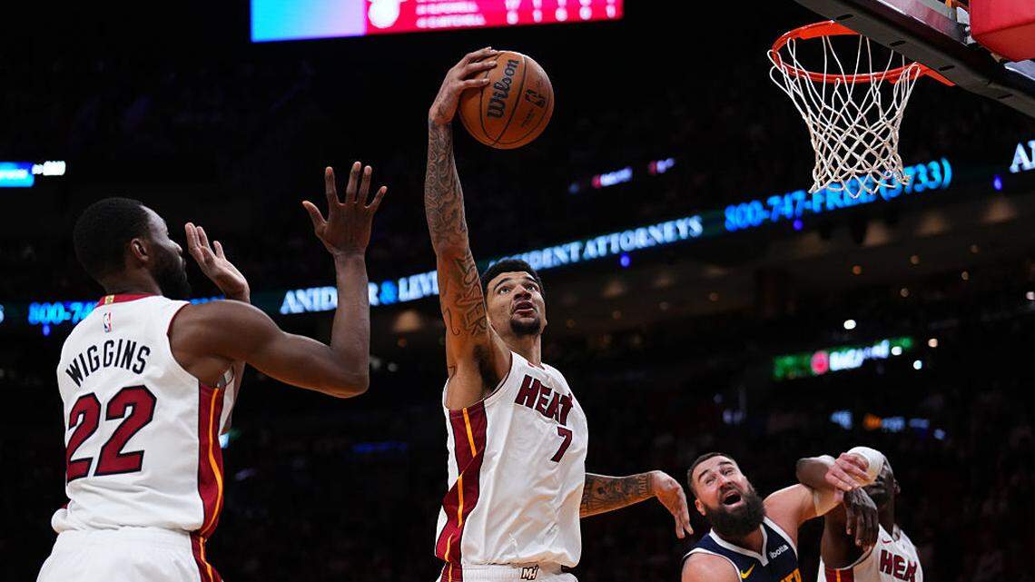 Kel'el Ware #7 of the Miami Heat collects a rebound against Jonas Valanciunas #17 of the Denver Nuggets during the third quarter at Kaseya Center on December 29, 2025 in Miami.