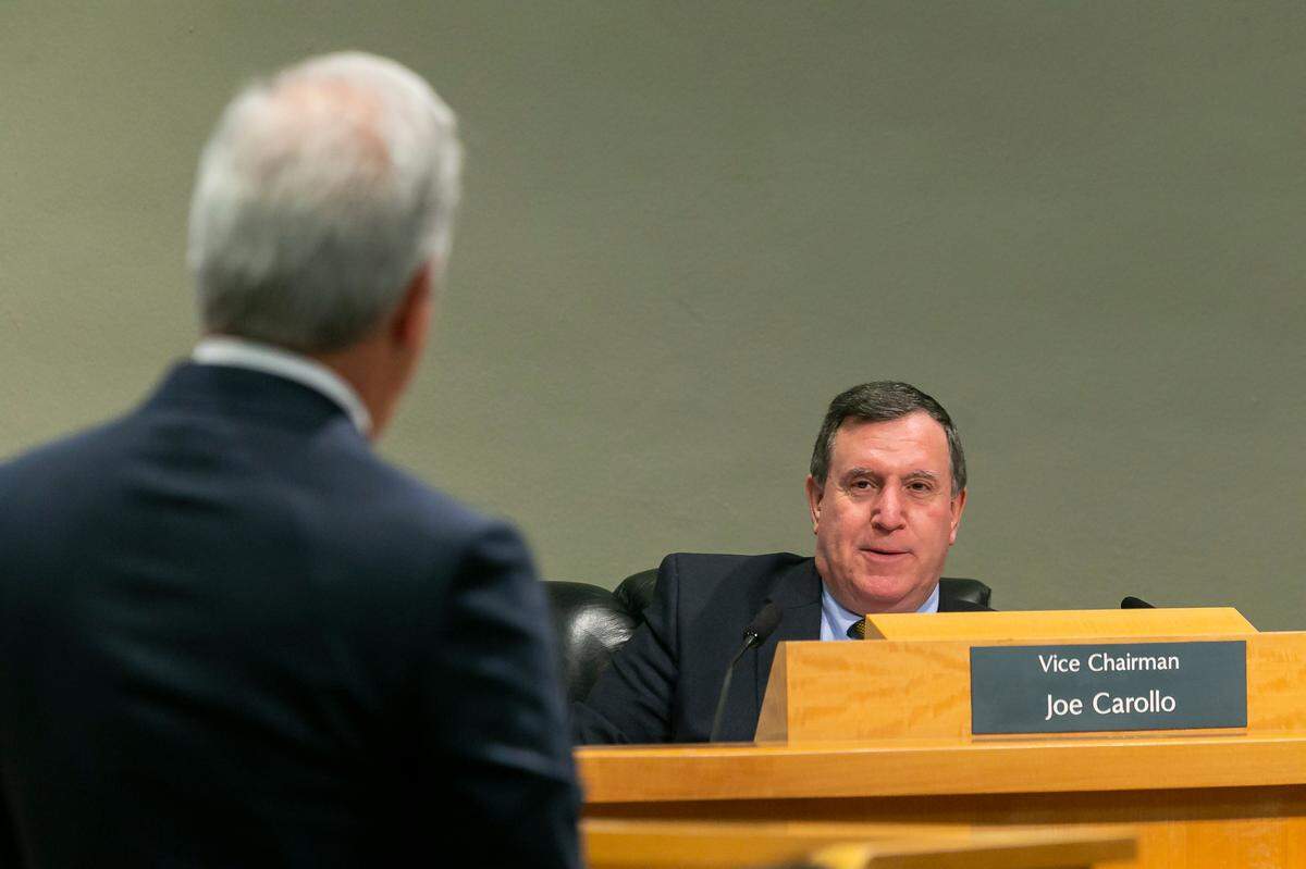 Commissioner Joe Carollo, right, speaks with Inter Miami co-owner Jorge Mas during a special meeting at Miami City Hall in 2022. A federal jury found Carollo used his power to retaliate against two Little Havana businessmen who supported his 2017 opponent. 