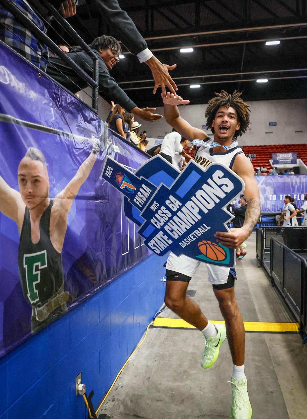 St. Thomas Aquinas’ Dwayne Wimbley Jr. (0) celebrates after the Raiders defeat Evans for the Class 6A boys’ basketball state championship at the RP Funding Center in Lakeland, Florida on Saturday, March 8, 2025.