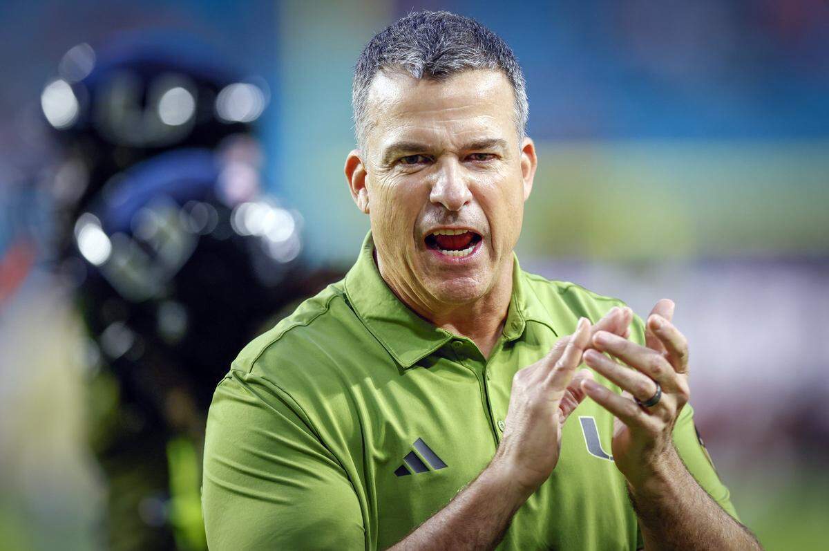 Miami Hurricanes head coach Mario Cristobal on the field during the NCAA football game against the Stanford Cardinal at Hard Rock Stadium in Miami Gardens, Florida, on Saturday, October 25, 2025.