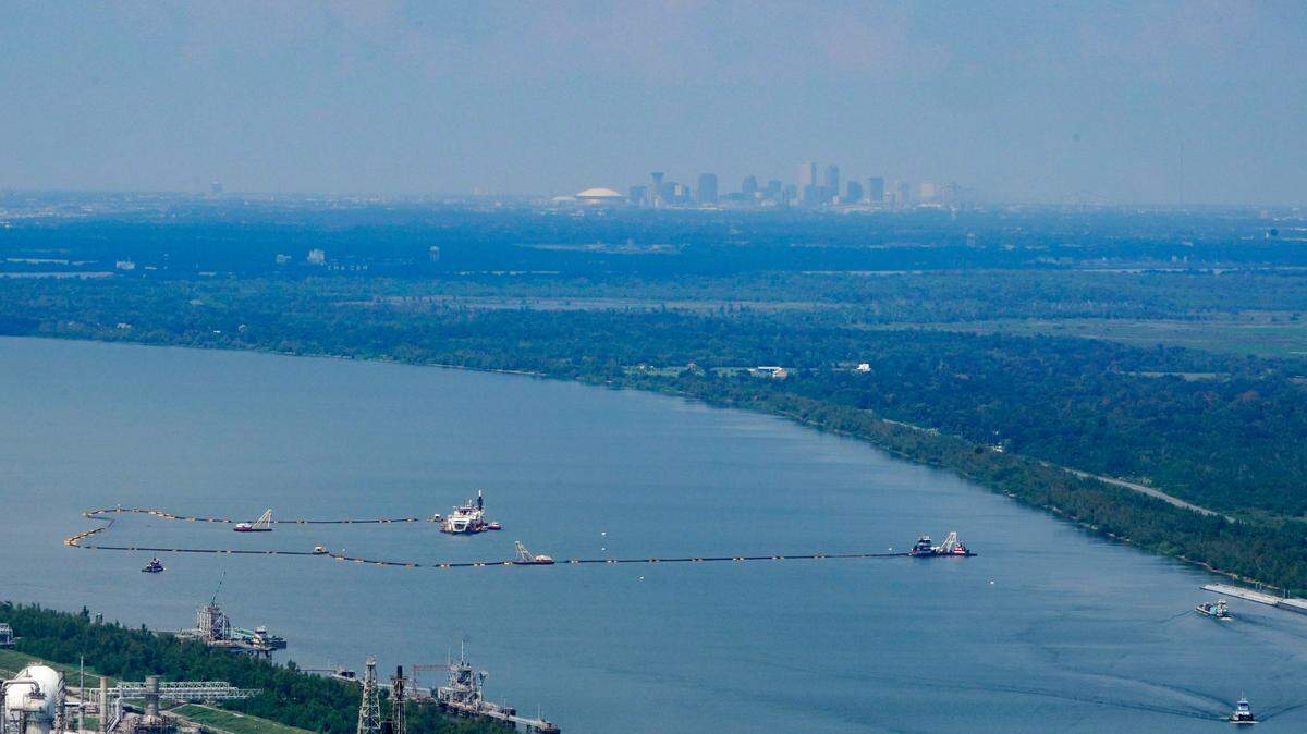 In this aerial photo, dredging operations to build an underwater sill are seen, with the city of New Orleans in the background, in Plaquemines Parish, La. Salt water from the Gulf of Mexico has caused problems for water systems in Plaquemines Parish.