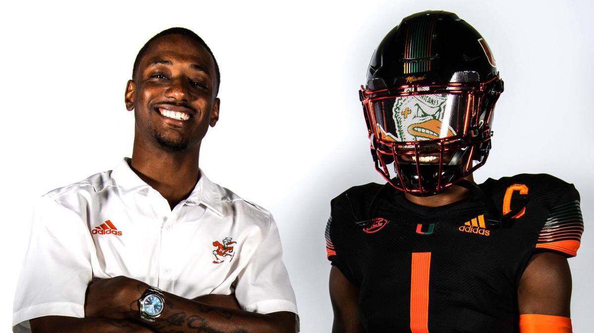 Khamauri Rogers (left) poses with cornerbacks coach DeMarcus Van Dyke while on an unofficial visit with the Miami Hurricanes on June 1, 2021.