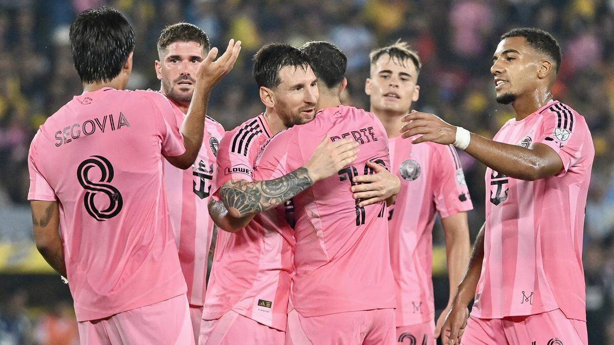 TOPSHOT - Inter Miami's Argentine forward #10 Lionel Messi (C-L) celebrates scoring his team's first goal during the friendly football match between Ecuador's Barcelona and the US' Inter Miami at the Banco Pichincha Stadium in Guayaquil, Ecuador, on February 7, 2026. (Photo by Marcos PIN / AFP via Getty Images)
