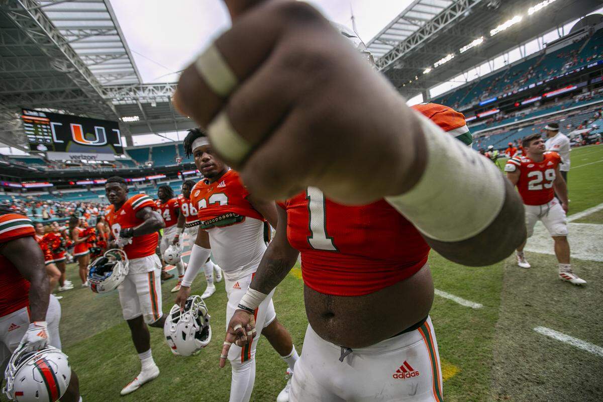 Miami Hurricanes defensive tackle Nesta Jade Silvera (1) vents his frustration as he points his fist toward the camera lens while leaving the field after the University of Miami is defeated by Georgia Tech on Saturday, October 19, 2019.