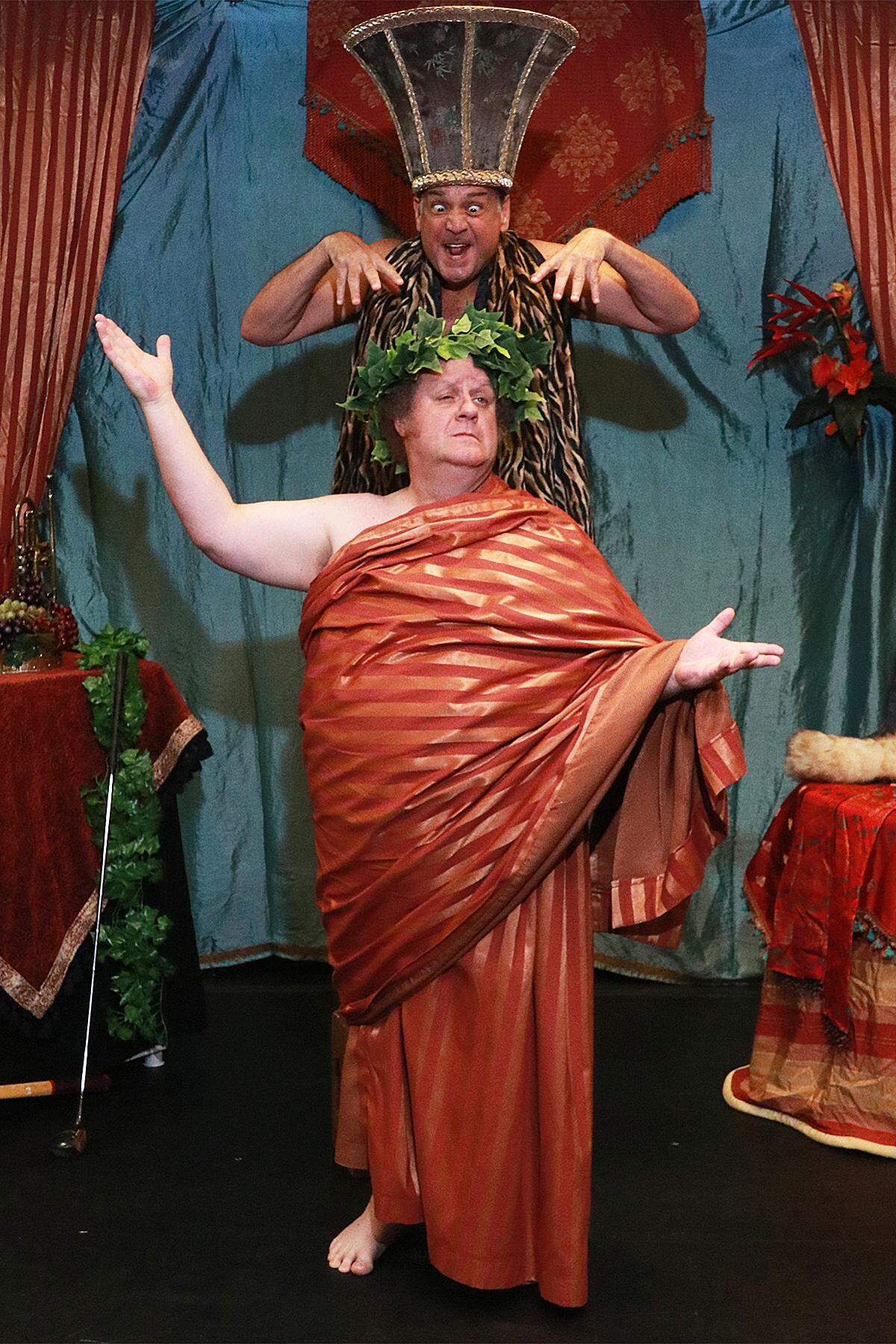 Nick Santa Maria gets ready to pounce on Ken Clement in the Actors’ Playhouse production of ‘The Big Bang.’