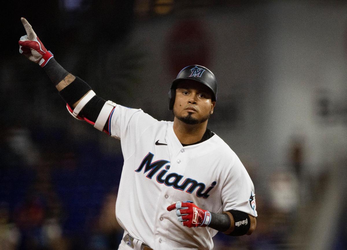 Miami Marlins second baseman Luis Arraez (3) points to the sky after hitting a home run, the second of three home runs in a row for the Marlins, during the eight inning of a baseball game on Monday, Aug. 14, 2023, at loanDepot Park in Miami.