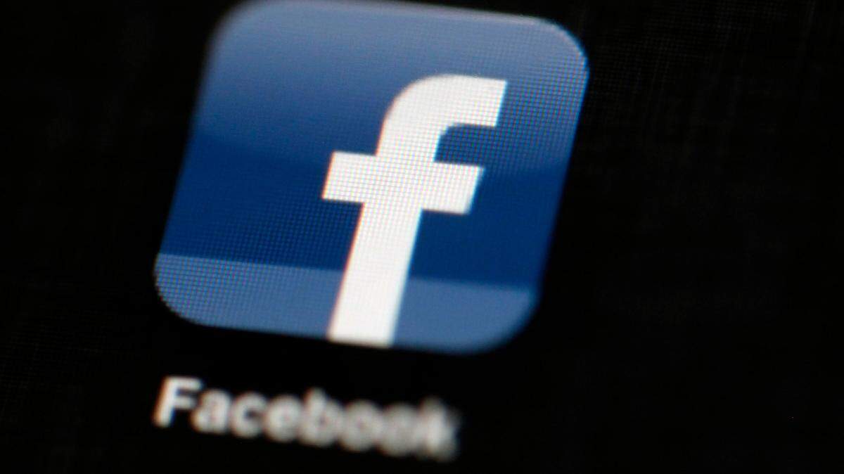 In this May 16, 2012, file photo, the Facebook logo is displayed on an iPad in Philadelphia. On Wednesday, Dec. 9, Florida Attorney General Ashley Moody joined 45 other states Wednesday in a lawsuit against Facebook, accusing the social media giant of engaging in anti-competitive practices.