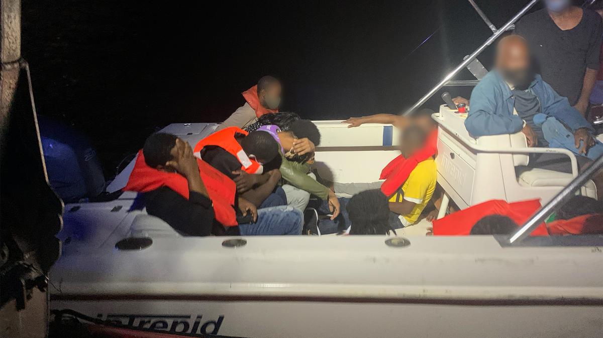 U.S. Coast Guard interdicted 23 Haitian migrants and two suspected Bahamian smugglers on a 25-foot pleasure craft approximately 10 miles east of Palm Beach, Florida, Oct. 09, 2020. 