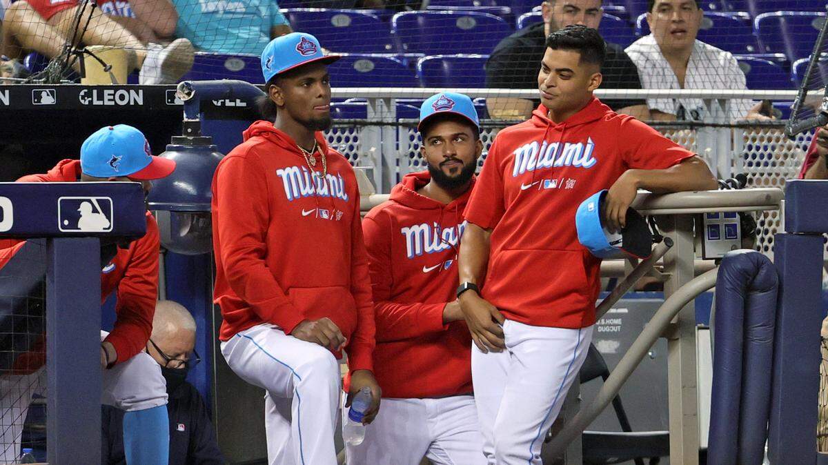 (From left to right) Miami Marlins pitcher Pablo Lopez, Edward Cabrera, Sandy Alcantara, Jesus Luzardo (44) look from the dugout during the eighth inning of their baseball game against the Philadelphia Phillies  at loanDepot park on Sunday, September 5, 2021 in Miami, Florida.