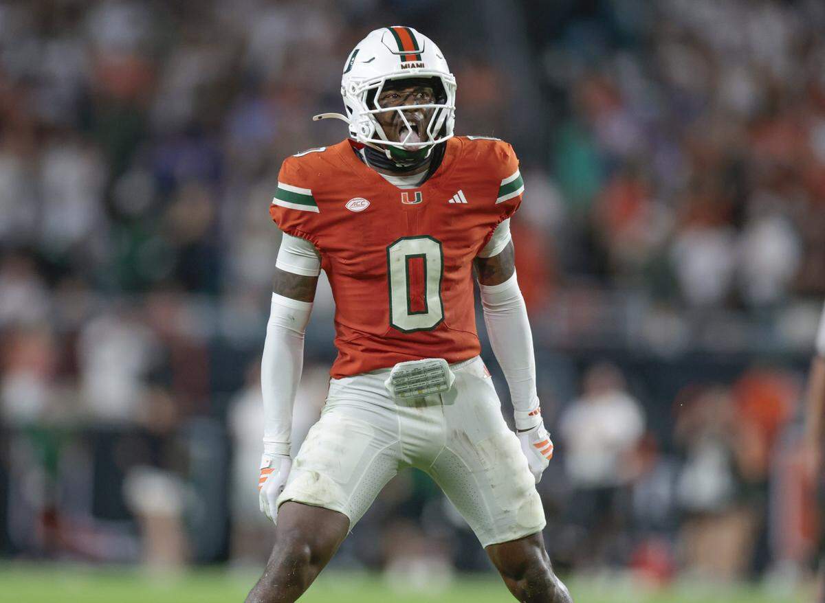 Miami Hurricanes defensive back Keionte Scott (0) motivates the crowd to make noise during their NCAA football game against the Florida Gators.