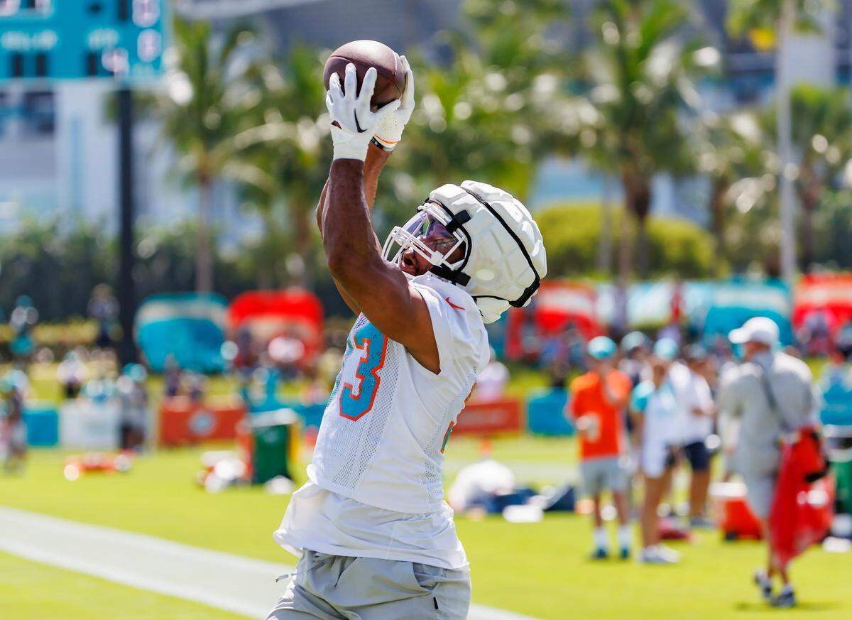 Miami Dolphins running back Chris Brooks (33) participates in a drill during NFL football training camp at Baptist Health Training Complex in Hard Rock Stadium on Sunday, July 30, 2023 in Miami Gardens, Florida.