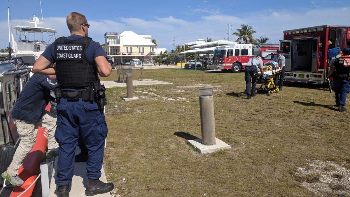 A Coast Guard Station Islamorada 33-foot Special Purpose Craft-Law Enforcement crew transfers a 66-year-old woman to emergency medical services at Station Islamorada Sunday, March 17, 2019.