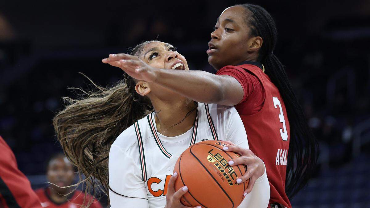ATLANTA, GEORGIA - MARCH 04:  Ra Shaya Kyle #0 of the Miami Hurricanes drives against Nunu Agara #3 of the Stanford Cardinal during the first quarter of the first round of the Women's ACC Tournament at Gas South Arena on March 04, 2026 in Duluth, Georgia. (Photo by Kevin C. Cox/Getty Images)