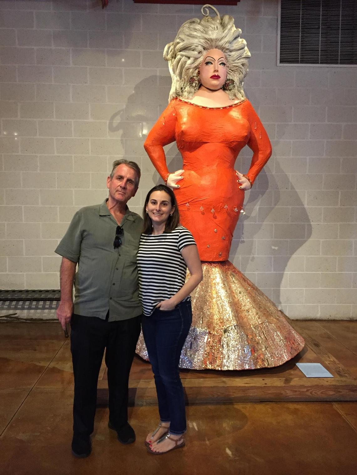 Tom Austin and his daughter Claire Austin in front of a sculpture of Divine at the Baltimore American Visionary Arts Museum circa 2018.