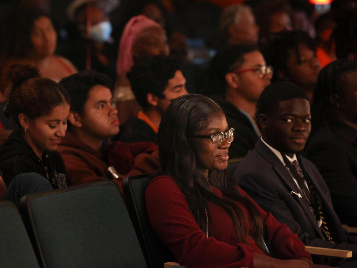 Azorea McGill, 18, a senior at Booker T. Washington Senior High School, sits in the audience before receiving a $30,000 scholarship from the Biscayne Bay Kiwanis Club during the Student Awards Ceremony Tuesday, May 24, 2022, at the Overtown school. McGill worked up to 36 hours per week during high school while serving as class president and completing at least 465 hours of community service. McGill is attending Alabama State University in the fall.