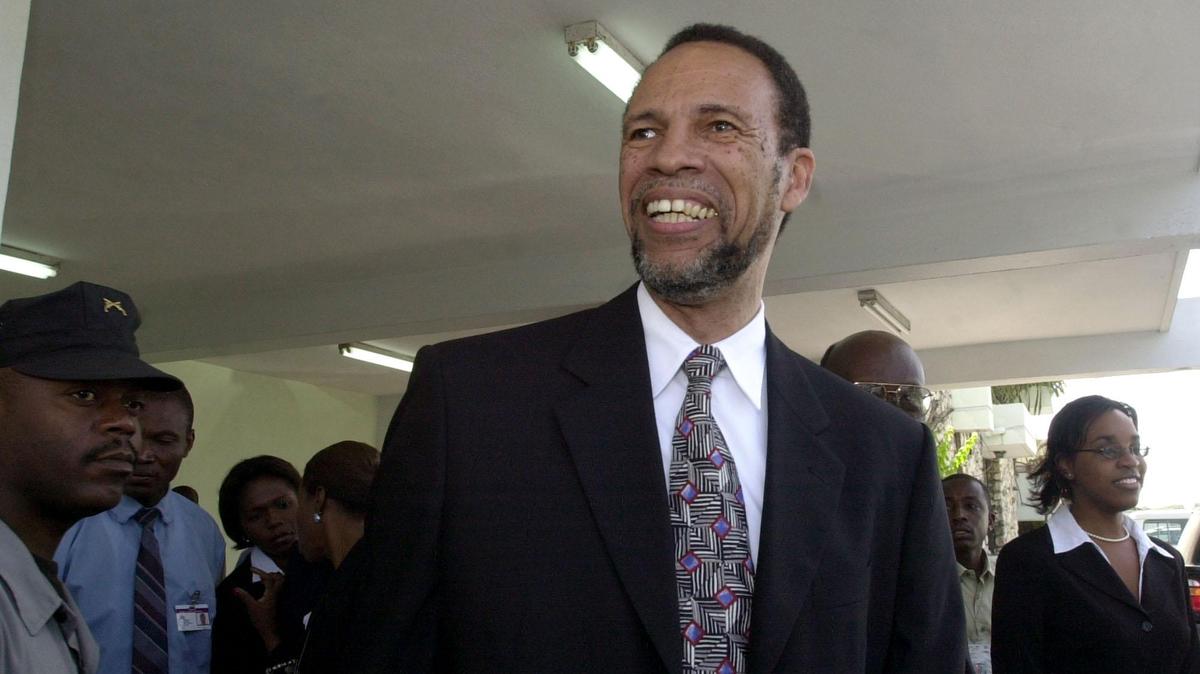 In this file photo, Caribbean Community (CARICOM) Assistant Secretary-General Colin Granderson arrives at the international airport in Port-au-Prince, Haiti, on Tuesday, July 13, 2004. A delegation of five Caribbean foreign ministers arrived to meet Haiti’s interim leaders, hoping to restore relations after the ouster of President Jean-Bertrand Aristide.