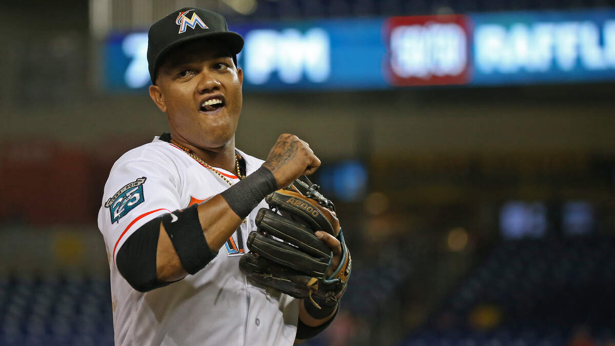 Miami Marlins second baseman Starlin Castro runs into the dugout during the third inning of a Major League Baseball game against the St. Louis Cardinals at Marlins Park on Wednesday, August 8, 2018.