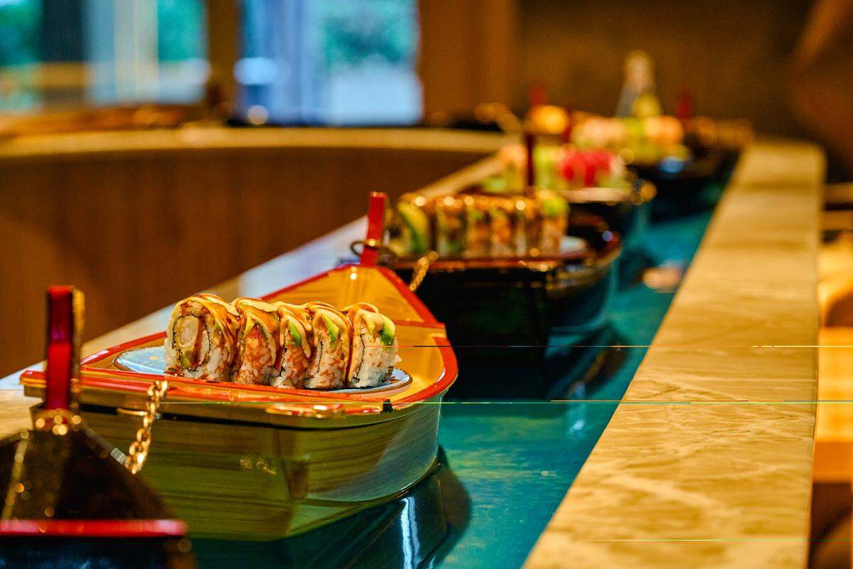 Sushi boats deliver your dinner at the counter of Tokyo Tuna in South Miami.