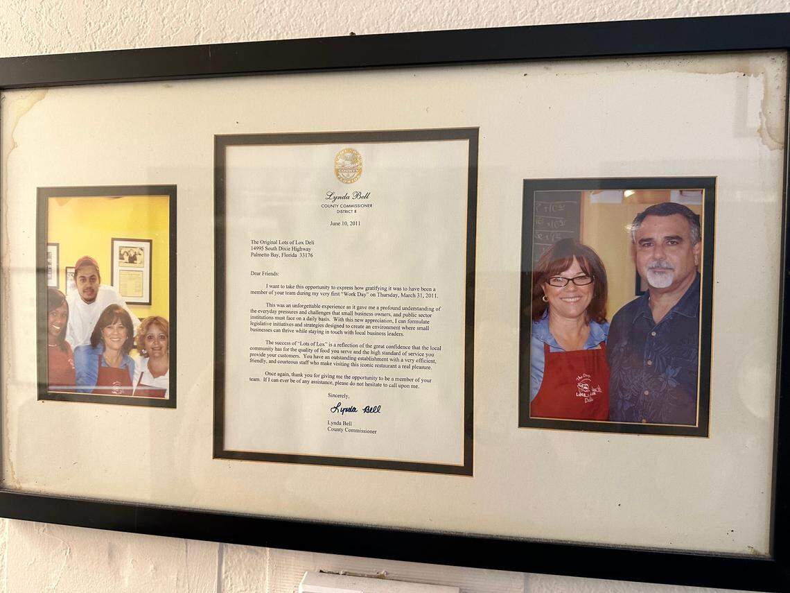 A letter from Miami-Dade County Commissioner Lynda Bell hangs on the wall honoring the Poulos family of Lots of Lox fame at the Palmetto Bay restaurant. Bell did a “Work Day” at the deli in March 2011.