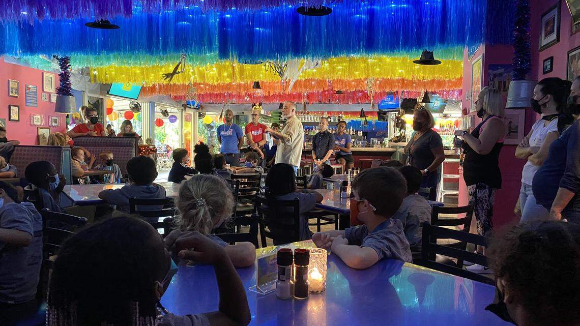 Wilton Manors Elementary School children sit at tables inside Rosie’s Bar and Grill Wednesday, Oct. 28, 2021.