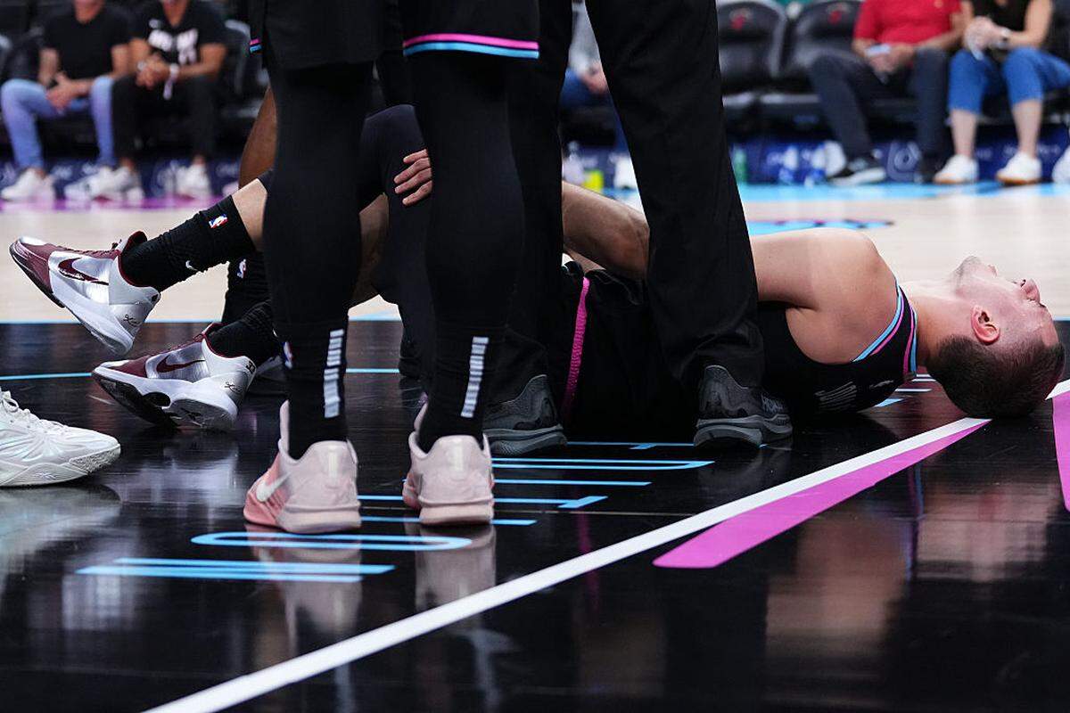 Nikola Jović #5 of the Miami Heat reacts to an apparent injury against the Washington Wizards during the fourth quarter at Kaseya Center on April 04, 2026 in Miami, Florida.