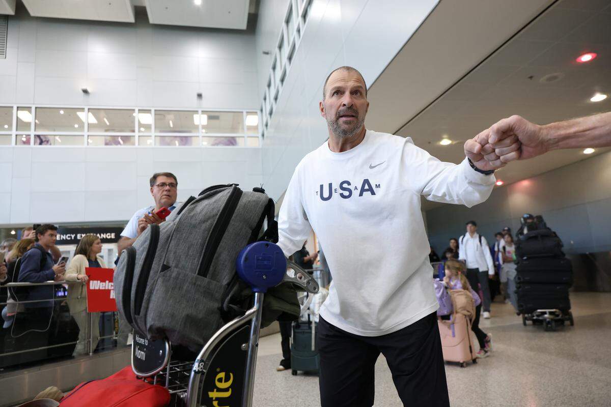 Florida Panthers general manager Bill Zito greets fans upon arrival at Miami International Airport on Monday, Feb. 23, 2026, in Miami, after returning from Milan following the Americans' gold-medal victory over Canada at the 2026 Winter Olympics in Milano Cortina, Italy.